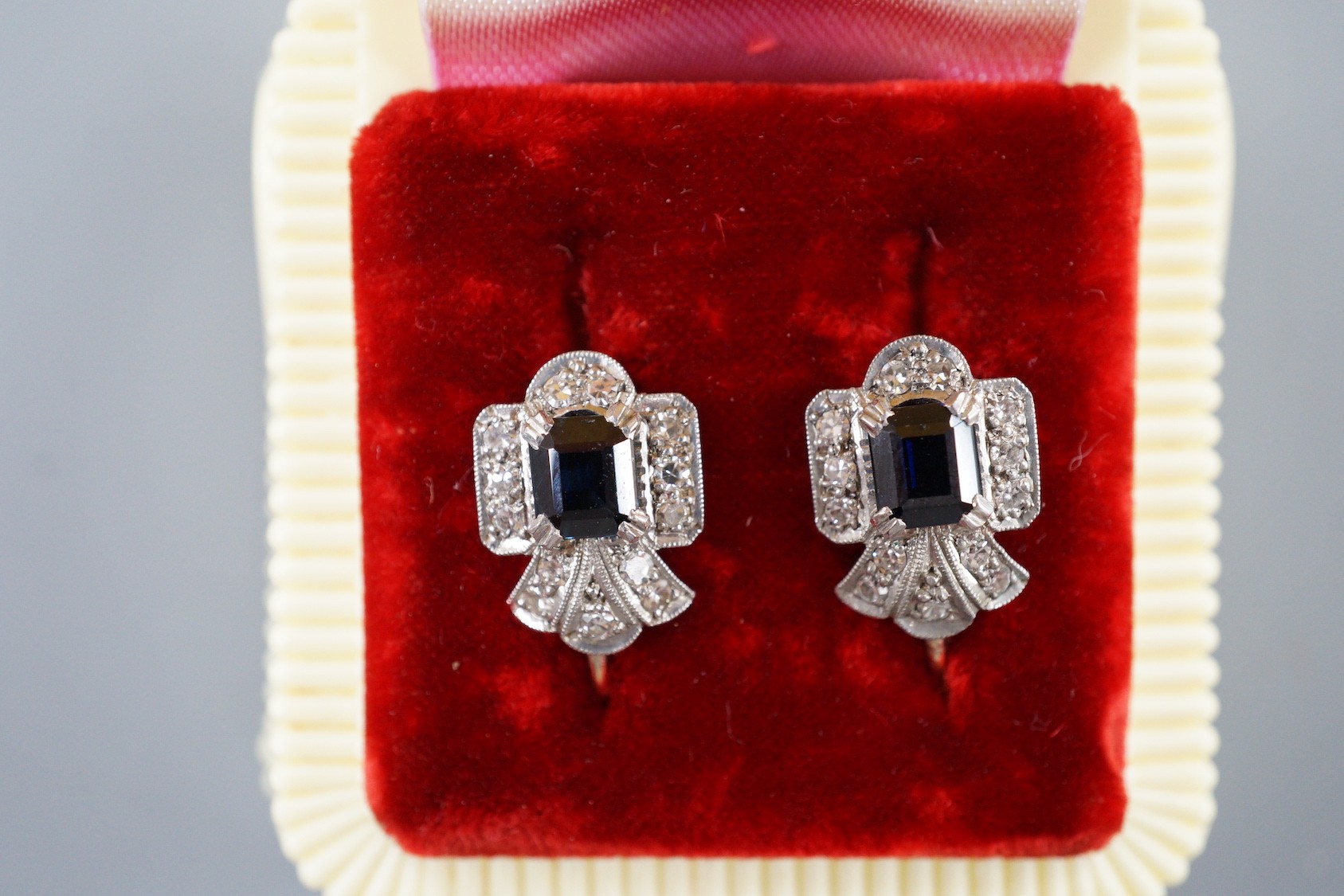 A pair of 9ct, sapphire and diamond set shaped cluster ear clips, 12mm, gross weight 2.9 grams.